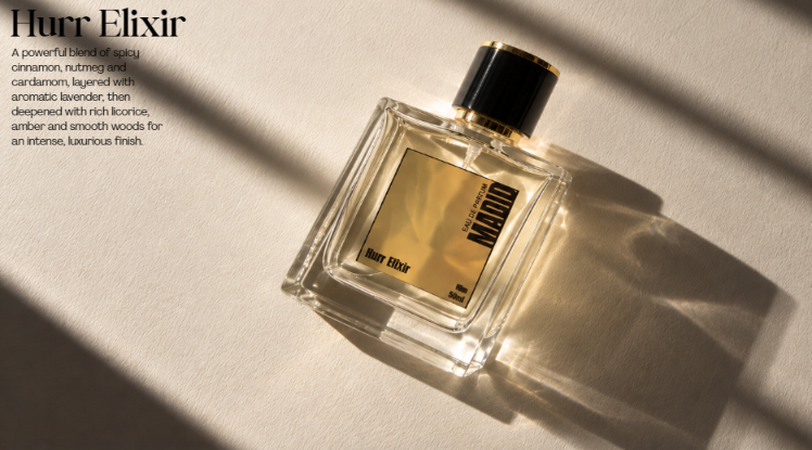 HANIYAH perfume bottle in warm light with editorial product copy